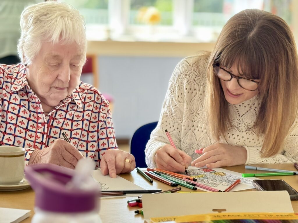 two-people-crafting-in-a-social-setting