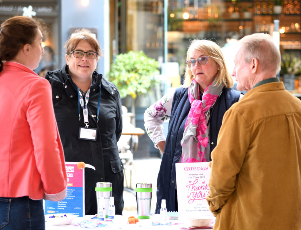 members of the public engaging with stalls at the volunteers in the square event