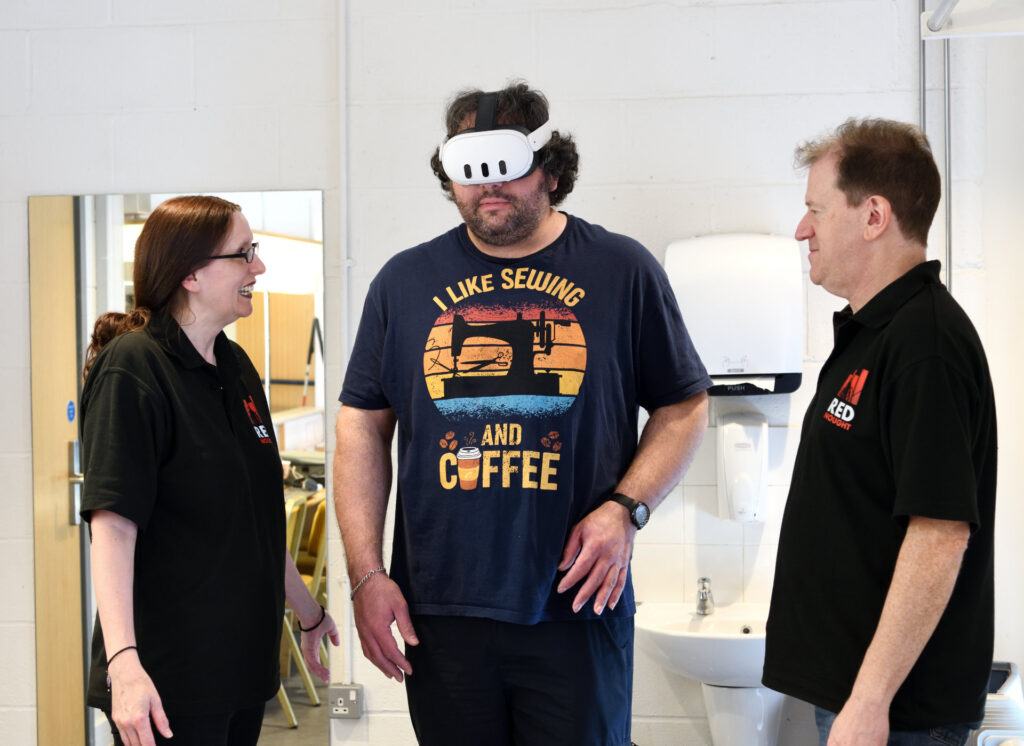 An attendee at the see, hear, remember exhibition trying a virtual reality headset experience