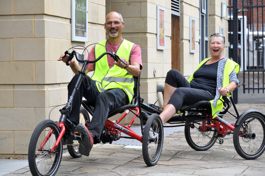 Attendees at the see, hear, remember exhibition trying out an accessible cycling experience